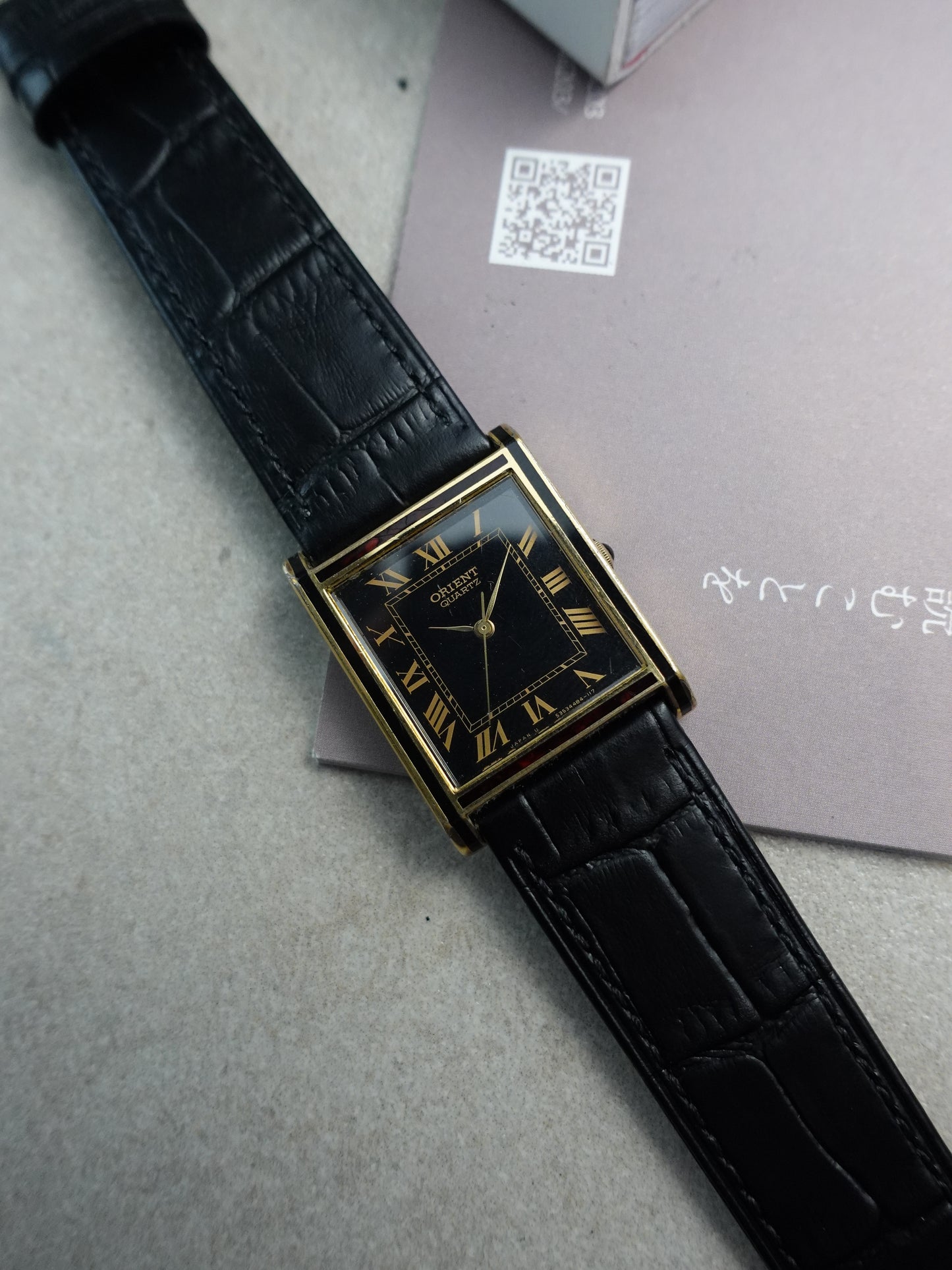 Orient Tank Art Deco case with ruby lacquer inserts on case