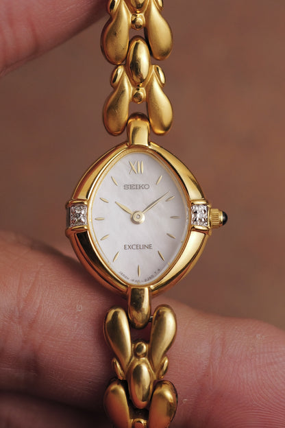 Seiko Exceline Mother of Pearl dial Tear-drop Bracelet in Gold Circa. 1989